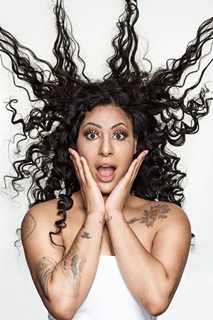 curly hair motion surprise expression The Loft Salon